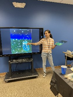 Artist demonstrating at digital board